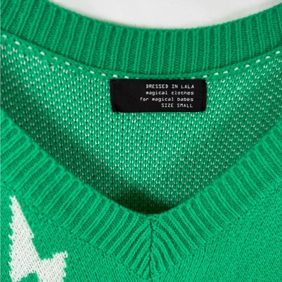 Dressed in LALA V-Neck Green Sweater with White Lightning Bolts - Picture 2 of 4